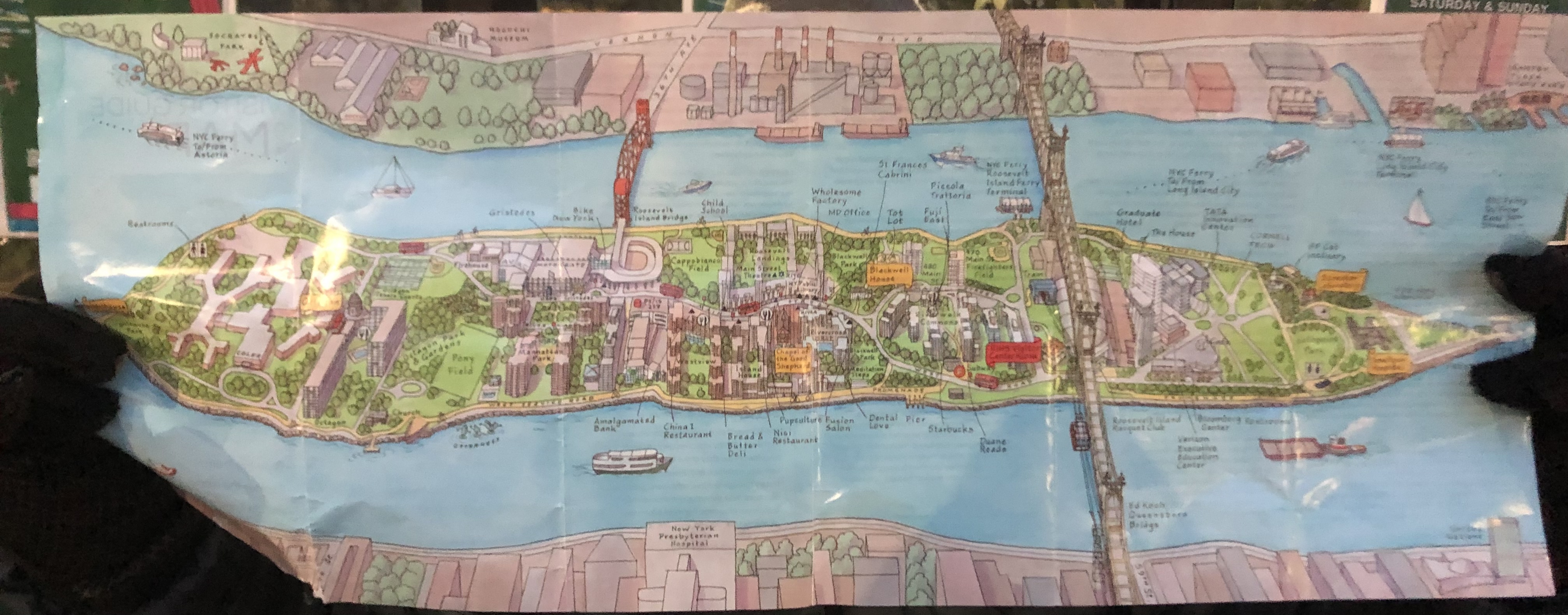 Hand-drawn illustrated map of Roosevelt Island showing its buildings, parks, bridges and the tram.